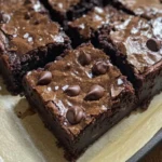 Delicious and fudgy zucchini brownies topped with chocolate, perfect for dessert.